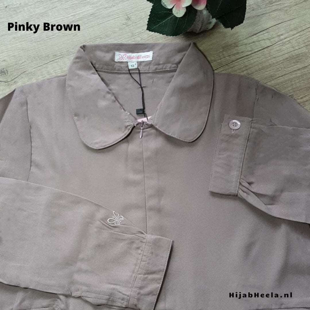 a pair of scissors sitting on top of a cloth