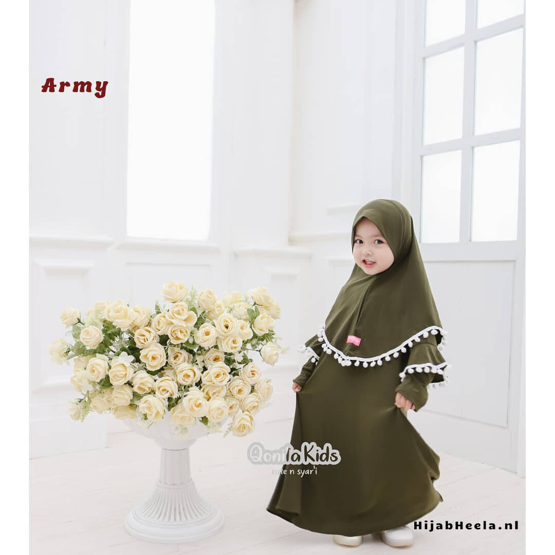 a woman standing in front of a vase of flowers
