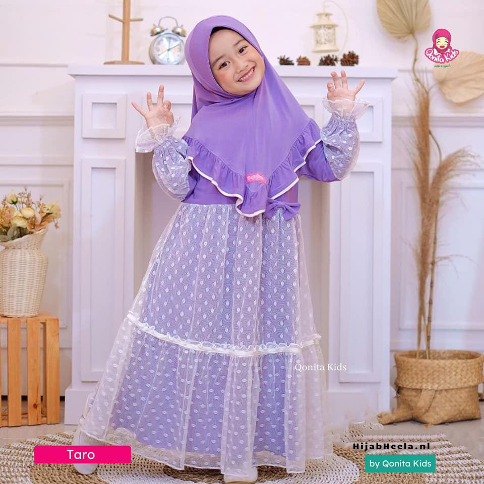 a woman in a pink dress holding a purple umbrella