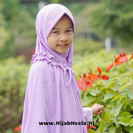 a little girl in a pink dress holding a <unk> 